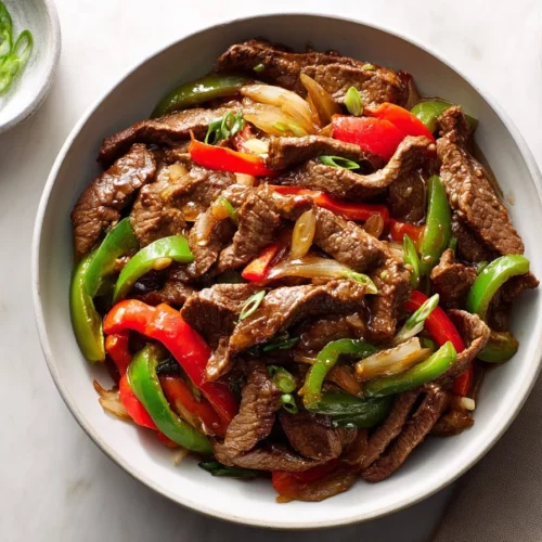 30-Minute Pepper Steak Stir Fry served with colorful vegetables